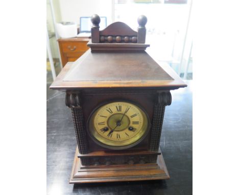 A Beech cased mantle clock, Roman Numerals to dial, striking on the hour and half hour - in working order