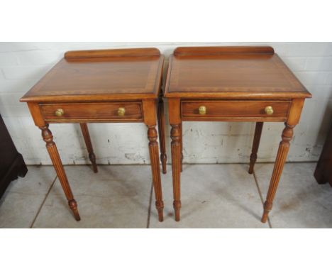 A pair of antique style rosewood lamp side tables each with a single drawer on turned reeded legs - Height 77cm x 51cm x 43cm
