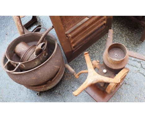 Various ironware to include a fire grate, Victorian boot scraper, saucepans, basket, grinder etc