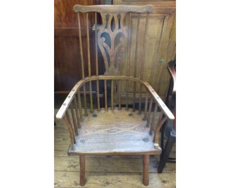 An 18th Century part elm stick back country elbow chair