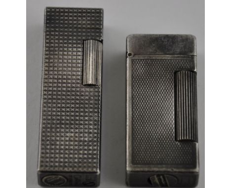 A Dunhill white metal 'Rollagas'  lighter, decorated with engine turning, together with a Colibri white metal lighter, (2)