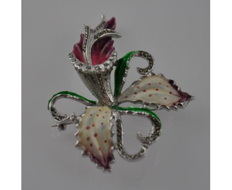 A white base metal costume jewellery enamel brooch, in the form of an orchid set with diamanté.