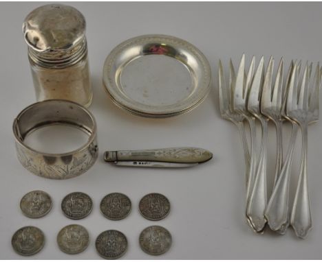 Six 20th century white metal dishes, probably Egyptian, together with white metal bangle engraved with exotic birds and folia
