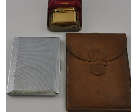 A gentleman's travelling mirror, the rectangular polished metal sheet with loop handle within a pigskin wallet, together with