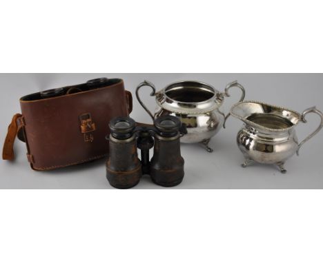 A pair of early 20th century French field glasses, by Chevalier, the frame incorporating a compass; together with another pai