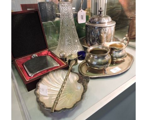 A late Victorian silver plated biscuit box, a plate mounted claret jug, scallop shell butter dish, pewter hip flask and sundr