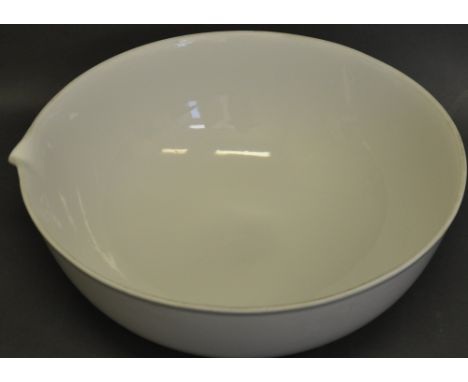 A Royal Worcester blanc de chine large mixing bowl, the rim with a pouring lip, D. 41cm.