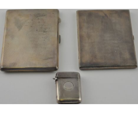 A silver cigarette cases, Birmingham 1927, of engine turned rectangular form with a gilt lining, together with another simila