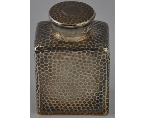 A late Victorian silver tea caddy and cover of hammered rectangular form, Drew and Sons, London, 1896. H. 10cm.