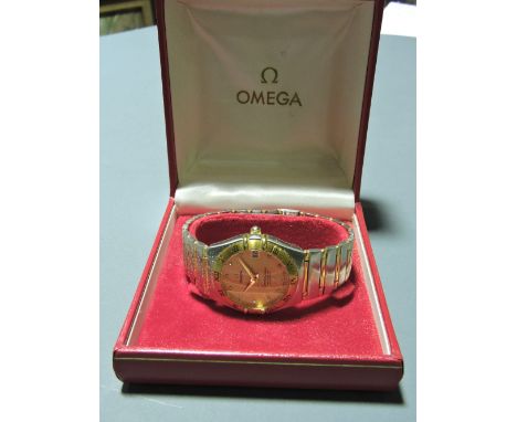An Omega Constellation gold plated and steel gentleman's wristwatch, the engine turned gilt dial with date aperture, within a