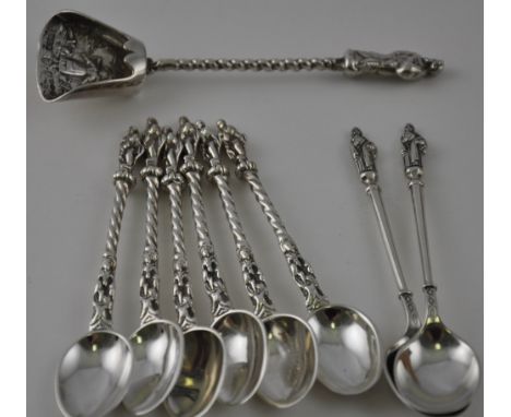 A set of six Victorian cast silver apostle teaspoons, London, 1892, two similar silver spoons and a Dutch white metal caddy s
