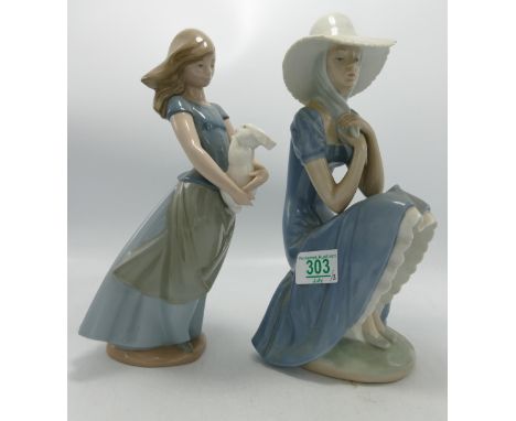 Nao figure of a lady sitting down : together with a lady holding a bunny ( ears A/F) 