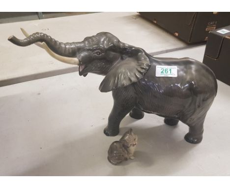 Beswick Elephant - Trunk stretching 998: one tusk re-stuck, together with a Royal Doulton small seated cat (2). 