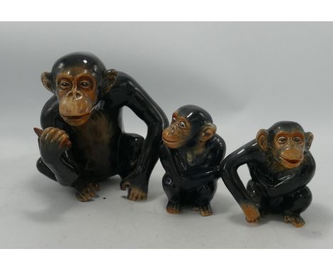 Sylvac pottery model of a seated monkey holding a banana: together with similar items, tallest 16cm(3) 