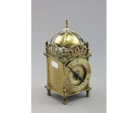 A small brass Smiths of England lantern clock of 17th century design; complete with Smiths of England movement