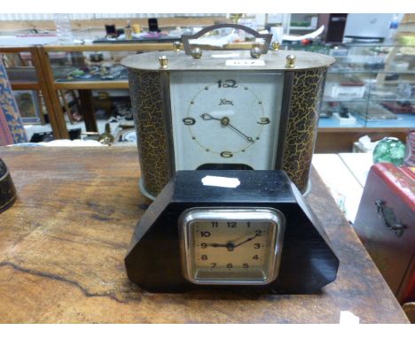 A Koma brass cased mantle clock; of rectangular form; with rounded corners; together with a small shaped ebonised Art Deco ma