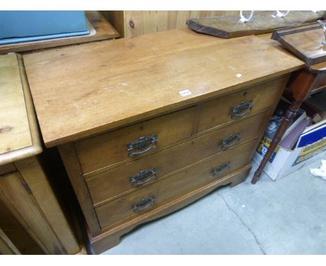 A vintage oak chest of 2 short and 2 long drawers