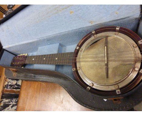 Two vintage cased banjo type musical instruments