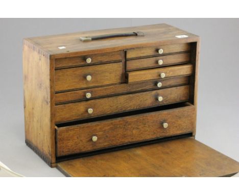 A vintage oak multi drawer collectors chest