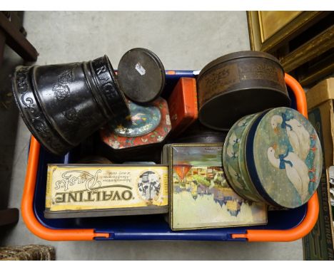 A crate of vintage advertising and other tins