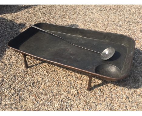 A large 19th century copper drip pan; c1840; with ladle