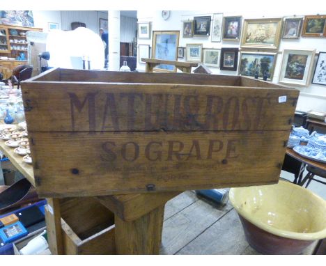 A vintage pine Mateus Rose bottle carrier