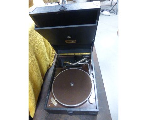 A vintage His Master Voice record deck together with a large quantity of records