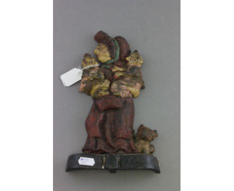 Painted Cast Iron Vintage Doorstop in the form of Judy (of Punch & Judy ) holding Two Babies with a Dog