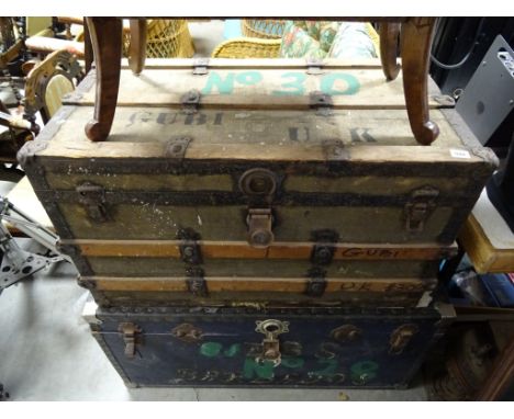 A vintage cloth and wooden bound trunk; together with metal trunk