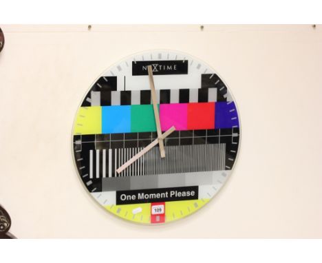 A retro glass hanging wall clock; decorated in the manner of a test a card