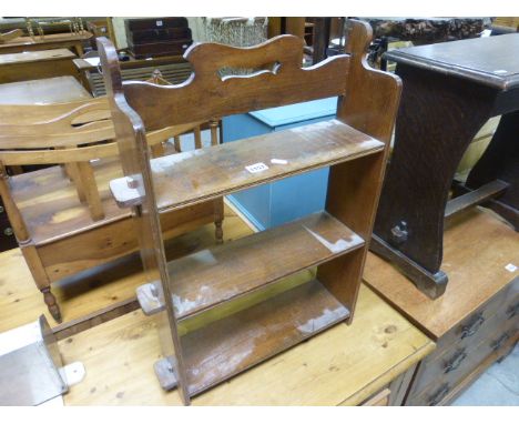 A small oak hanging wall shelf