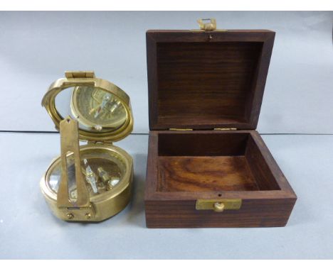 A reproduction brass compass; together with a wooden box