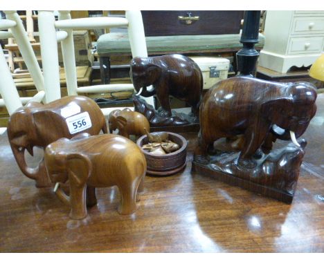 Box of hardwood vintage elephants to include a pair of rosewood bookends
