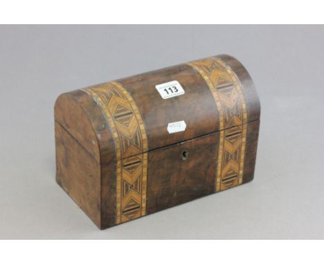 An inlaid Victorian walnut dome lidded two section tea caddy