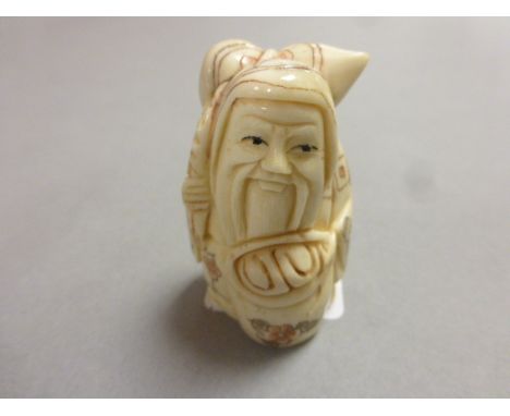 Signed oxbone netsuke of an old man traveller
