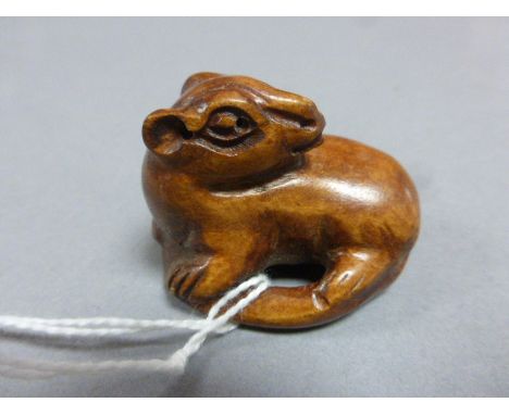 Signed wood netsuke of a beast