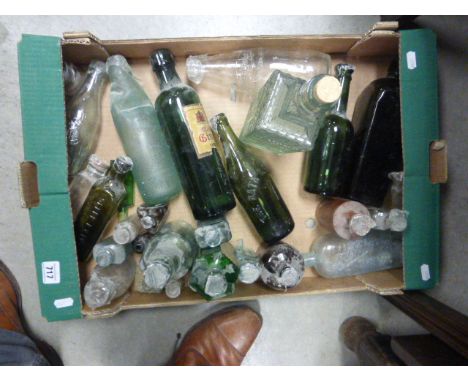 A box of various vintage glass bottles