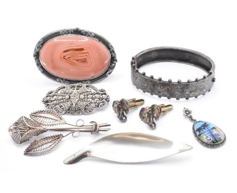 A selection of silver and white metal jewellery dating from the 19th Century onwards. The lot to include a white metal and ma