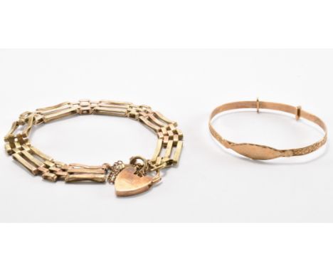 A hallmarked 9ct gold gate link bracelet with a heart padlock clasp, together with a yellow metal expanding christening bangl