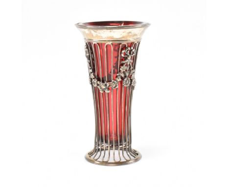 An early 20th Century Edwardian silver hallmarked stem / posy vase. The pierced silver body having pierced reeded decoration 