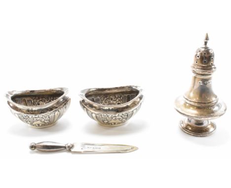 A group of 20th Century silver hallmarked items. The lot to include a pair of repousse decorated table salts (hallmarked Birm