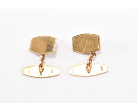 A pair of vintage mid 20th Century hallmarked 9ct gold cufflinks. The cufflinks having plain unengraved heads with engine tur