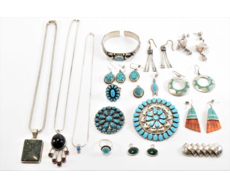 A collection of silver and white metal jewellery. The lot to include turquoise set Native American Navajo brooches, one being