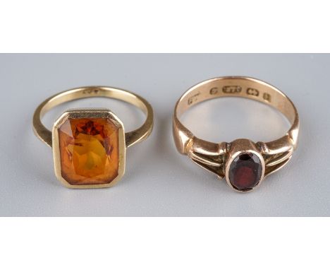 A 9k yellow gold and citrine dress ring, set in a canted rectangular bezel, size H1/2, approx 2.1g; together with a 9ct yello