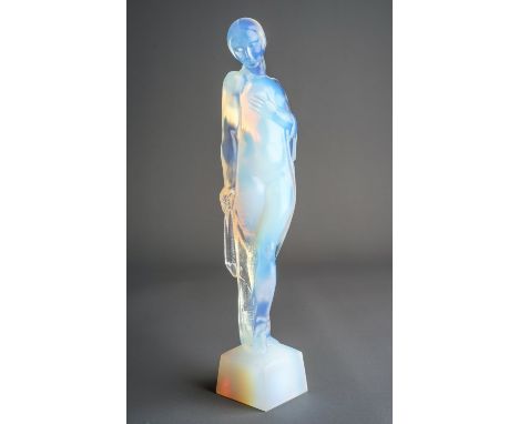 An Art Deco Sabino opalescent figure of Serenity, a female nude draped in a shawl and standing on a square plinth base, etche