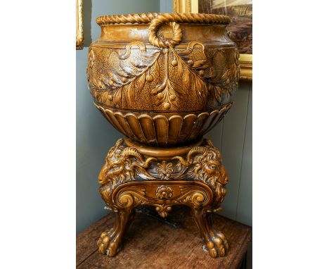 A late Victorian Burmantofts monumental earthenware amber glazed jardiniere on stand, the large bowl with ropetwist border ab
