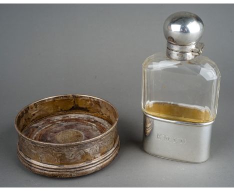 A Georgian style silver wine coaster, engraved decoration, turned centre, hallmarked Birmingham, 1989 together with an Edward