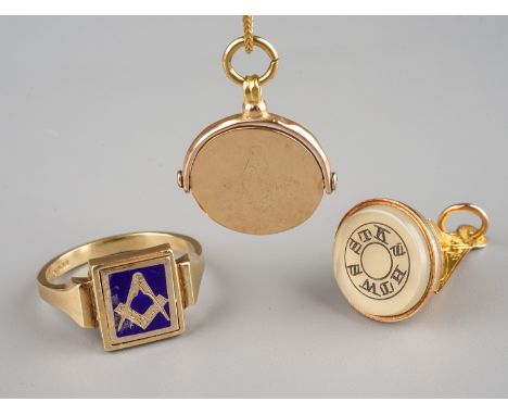 Masonic Interest - a 9ct yellow gold seal fob, with masonic instruments above a circular seal engraved with symbols, approx 3