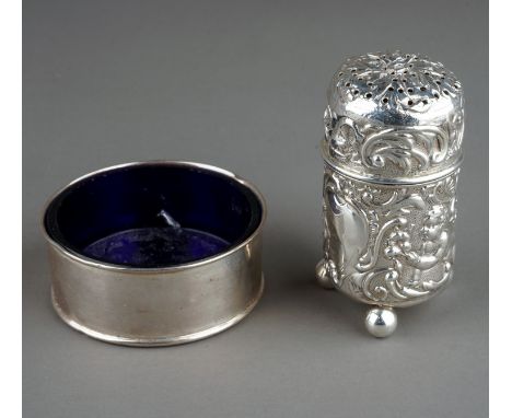 A late Victorian silver pounce pot, the body chased with seated putti, one playing a drum, with scrolling foliage on three ba