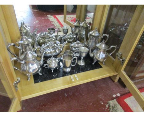 Shelf of silver plated tea & coffee pots etc